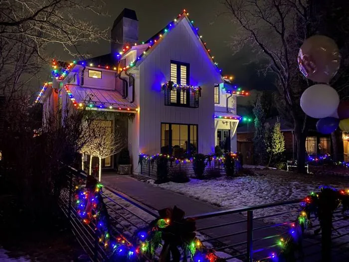 Multi-color C9 bulbs along a home's roofline